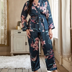 Satin floral pajama set with long sleeve tie-waist top and matching pants in teal