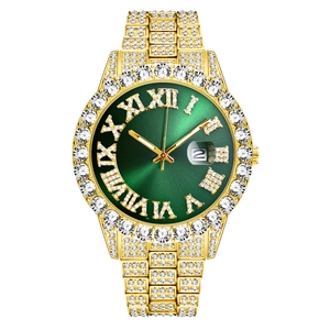 Detailed close-up of a gold luxury watch with a green dial and diamond bezel
