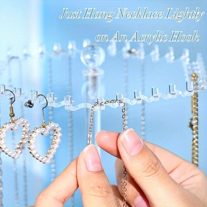 Clear acrylic rotating necklace holder with multi-hook stand for jewelry storage