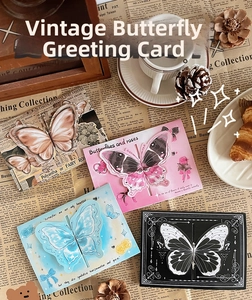 Macro shot of vintage 3D butterfly pop-up greeting cards with multi-layered paper cut design
