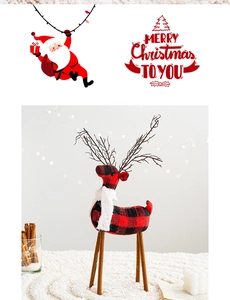 Macro detail of cotton buffalo plaid reindeer decor with plush scarf and wooden legs