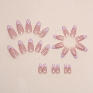 Pink French almond press-on nails with elegant pearl embellishments in a V-shape design