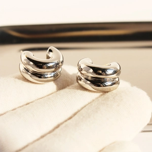 Minimalist silver double-layered C-shaped metal hoop earrings with high polished finish