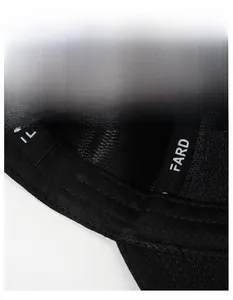 Close-up of the widened sweatband and breathable fabric inside the black baseball cap