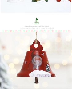 Detail of red metal Christmas bell pendant with Santa Claus pattern and hemp rope hanger