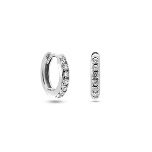 Macro view of silver hoop earrings featuring rows of brilliant round-cut cubic zirconia