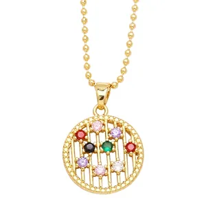 Gold beaded necklace featuring a circular open pendant set with vibrant multi-color zircons