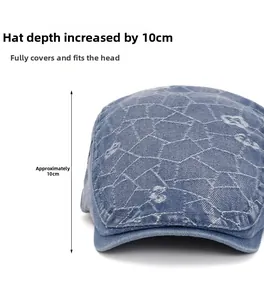 Detail view of denim flat cap showing 10cm depth design and blue floral patterns