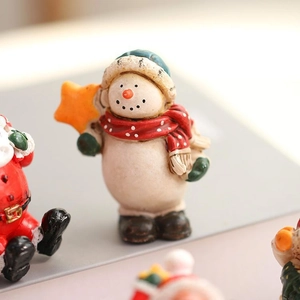 Christmas snowman resin ornament with red scarf and star for festive tree decoration