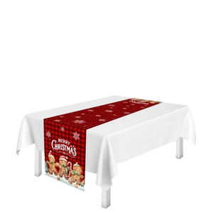 Christmas table runner with red and black plaid pattern and gingerbread man illustration