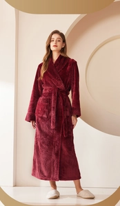 Detail of wine red flannel bathrobe showing textured shawl collar and diamond pattern cuffs