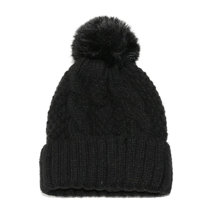 Detailed cable knit texture and large fluffy pompom on this black winter beanie hat