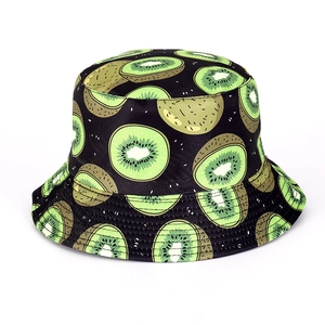Detail shot of black bucket hat featuring vibrant kiwi fruit slice pattern prints