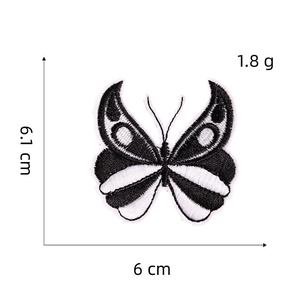 Detailed embroidery view of a black and white butterfly patch showing 6.1cm dimensions