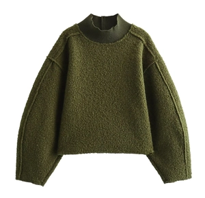 Detailed texture of army green sherpa fleece sweatshirt with ribbed high collar