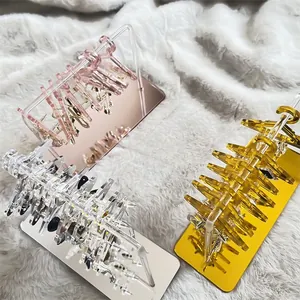 Detailed view of acrylic mini hanger earring organizers in rose gold and silver finishes