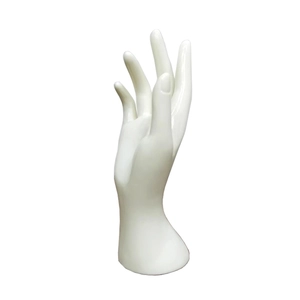 Close-up of white glossy plastic female hand model for jewelry and ring display