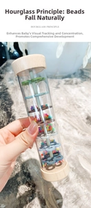Close-up of wooden rainmaker instrument showing colorful beads and internal structure