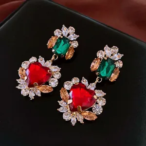 Elegant gold heart necklace and earrings set with red and emerald zircon stones