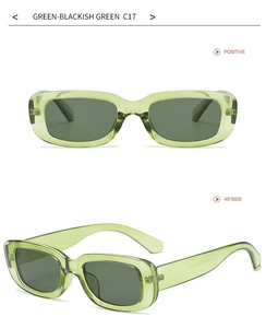 Detail view of transparent green rectangular sunglasses with dark green lenses C17