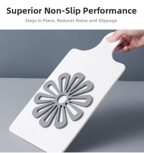 Gray floral silicone placemat demonstrating non-slip grip on a tilted surface