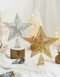 Detailed view of gold and silver glittered iron star toppers with spiral bases for Christmas