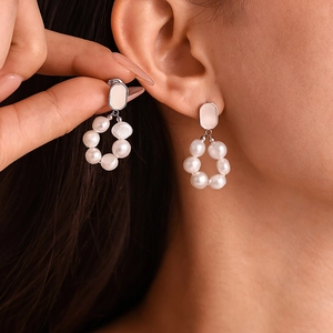 Elegant Ferris wheel freshwater pearl earrings in silver and shell finish for women