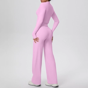Three-piece yoga set with pink zip jacket and wide-leg pants shown from a side view