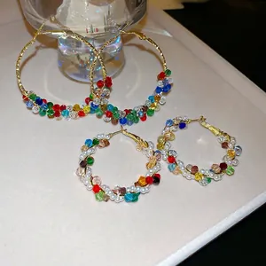 Colorful crystal and pearl wrap hoop earrings in gold setting with vibrant beads