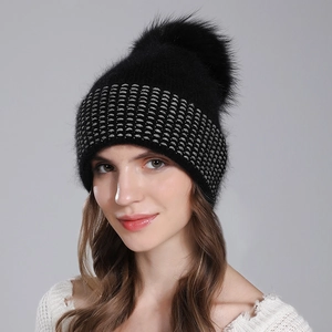Women's black knit winter beanie with fluffy real raccoon fur pom and silver thread detail