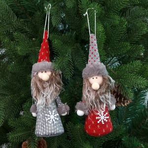 Christmas gnome hanging ornaments in red and grey knit fabric on a green tree branch