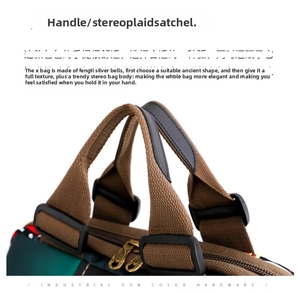Detailed view of gun-color hardware and ergonomic bi-color fabric handles on travel bag