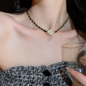 Elegant gold chain necklace with black leather weave flower and crystal number 5 pendant