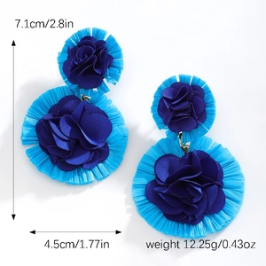 Detailed view of blue woven raffia flower earrings with exact size and weight dimensions