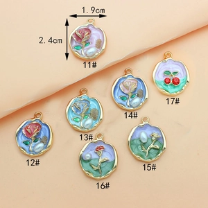 Set of 7 vintage enamel flower pendants with gold alloy frames for DIY jewelry making