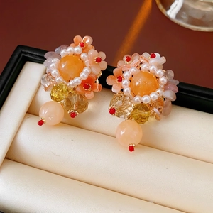 Elegant floral cluster earrings with orange stones and pearls in a jewelry gift box