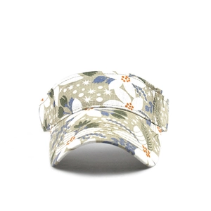 Close-up of ethnic floral print on light green open top sun hat with detailed stitching
