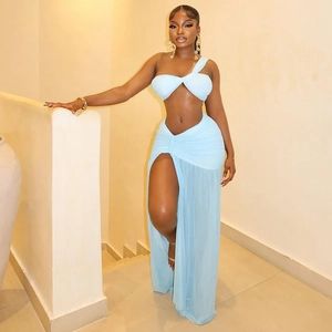 Detail of light blue two-piece set featuring a one-shoulder top and high slit skirt