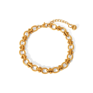 Detail of golden stainless steel chain bracelet with lobster clasp and S.STEEL logo tag