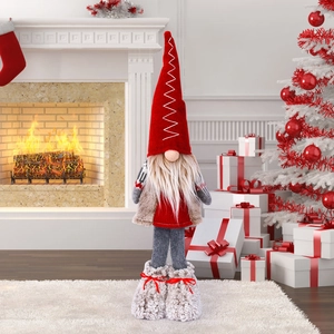 Nordic Christmas gnome plush with red plaid hat standing by a warm fireplace and tree