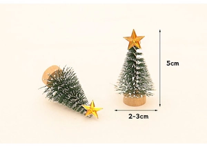 Detailed view of 5cm mini Christmas trees with snow effect, gold star and wooden base