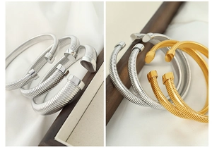 Detail showing elastic snake chain texture and metallic finish on adjustable bangles