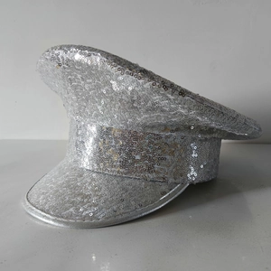 Macro view of sparkly silver sequins and fine stitching on the party captain hat