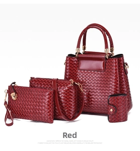 Detailed view of dark red woven texture on 4-piece tote bag set with gold hardware
