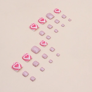 Pink heart and glitter press-on toe nails set featuring sweet layered heart patterns