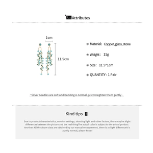 Detail view of long green stone tassel earrings with dimensions and material specs
