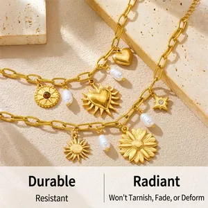 Detailed shot of vintage gold-plated chain bracelet with baroque pearls and heart pendants
