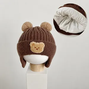 Cute warm brown baby winter knitted earflap hat with bear pom poms and cotton lining