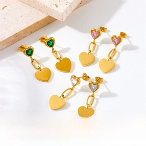 Detail view of gold-plated heart drop earrings with green, pink, and white crystal stones