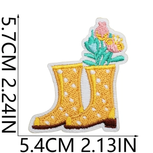 Detail of floral rain boot embroidery patch with precise dimensions and colorful stitching